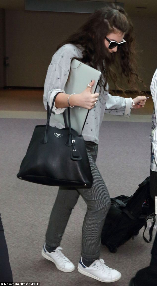 Songstress Lorde Seen Carrying a Black Prada Tote in Japan