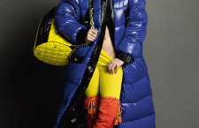 Katy Perry posing provocatively in bright colors holding on to a large moschino yellow quilted bag. Courtesy: Moshino